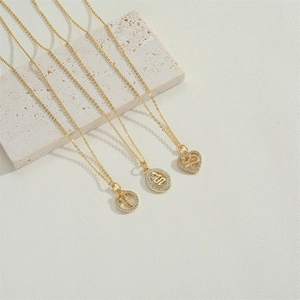 Elegant 14K gold plated necklaces featuring three unique snake pendants with zircon details