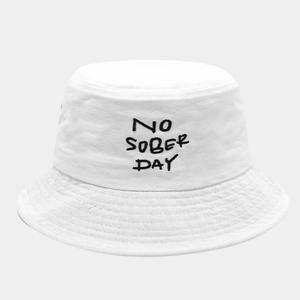 Close-up of black 'NO SOBER DAY' embroidery on white twill cotton fisherman hat