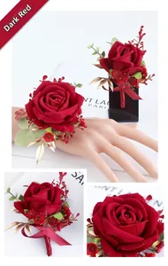 Close-up of dark red artificial rose boutonniere and wrist corsage with gold leaf details