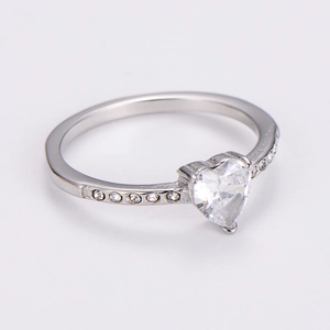Macro shot of a heart-shaped zircon ring in stainless steel with side accent stones