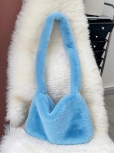 Detailed texture of fluffy sky blue faux fur hobo shoulder bag for winter fashion