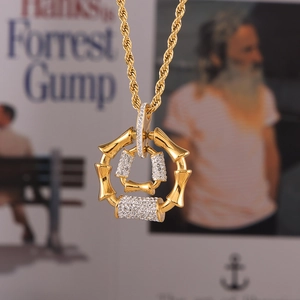 Golden bamboo joint ring necklace with micro-pave diamonds on twisted rope chain