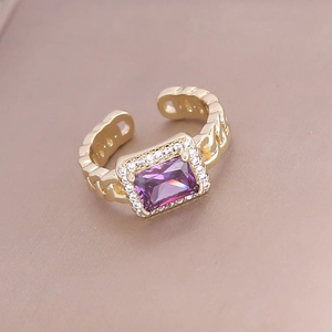 Detail of gold square purple zircon ring with shimmering micro-pave crystals