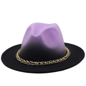 Detail of wool fedora with purple to black gradient finish and gold chain band