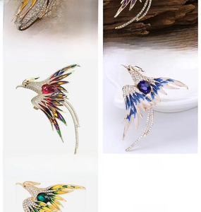Detailed display of colorful phoenix brooches with rhinestones in various color options