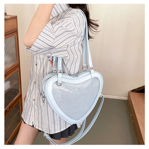 Light blue heart-shaped JK uniform bag with mesh panel shown on a model side view