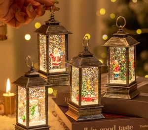 Detail of vintage Christmas lanterns featuring Santa and snowman with warm glowing LED lights
