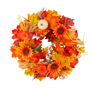 Autumn harvest wreath with maple leaves, sunflowers, and pumpkins on white background