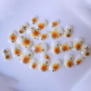 Short square press-on nails with fresh sunflower floral patterns on a creamy white base