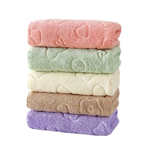 Five-piece soft coral fleece face towel set with embossed heart patterns in pastel colors