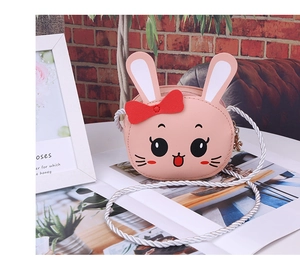 Close-up of pink bunny kids crossbody bag with PU leather and white rope strap