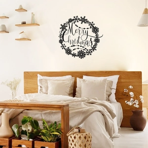 Macro detail of black Merry Christmas wreath wall decal on a minimalist bedroom wall