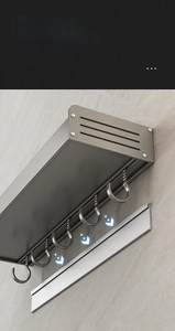 Detail of detachable kitchen rack showing removable slider mounting and 5 metal hooks