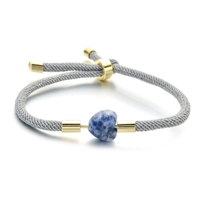Adjustable grey woven rope bracelet featuring a blue heart stone and gold metal accents