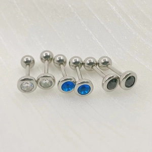 Three pairs of stainless steel barbell stud earrings with white, blue, and black cubic zirconia