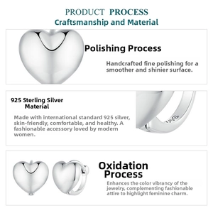 Detail showing S925 sterling silver stamp and polished surface on heart earrings