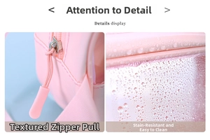 Detail of pink waterproof makeup bag featuring a smooth metal zipper and easy-clean fabric