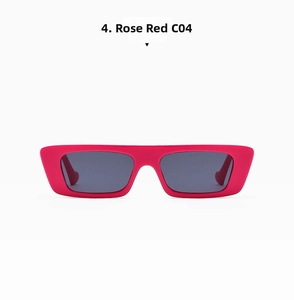Detail view of square rose red sunglasses with grey lenses and retro narrow frame