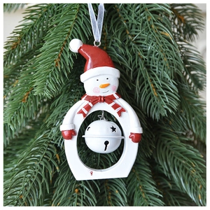 Close-up of resin snowman ornament with red hat and internal star-shaped metal bell