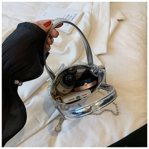 Interior view of the silver metallic handbag showing capacity for phone and cosmetics
