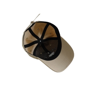 Inside view of khaki cotton baseball cap for kids with reinforced seams and metal buckle