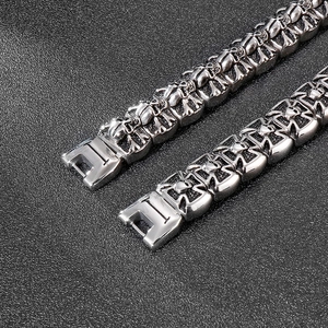Detailed close-up of retro silver skull and cross punk bracelets for men in titanium steel