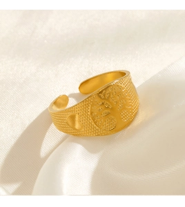 Macro shot of 18k gold plated stainless steel tree of life ring with embossed dots detail