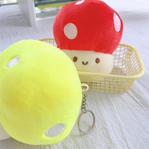 Cute mushroom plush keychain with vibrant red and yellow colors for bag decoration