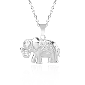 Detail of silver elephant pendant with ornate engravings and high-polished steel chain