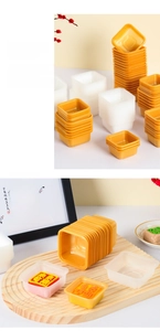Detailed view of square PP mooncake trays with non-slip lines in orange and white