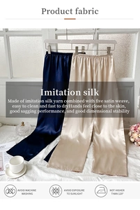 Vue détaillée du pantalon large en soie synthétique montrant la texture brillante du tissu