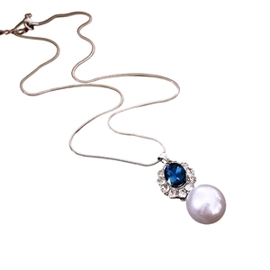 French style necklace with blue oval gemstone, small diamonds and a white pearl drop