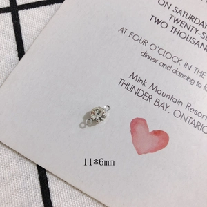 Macro shot of silver rhinestone charm connector measuring 11x6mm for DIY jewelry making