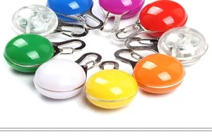 Macro shot showing diverse colors and the power switch icon on LED pet safety tags