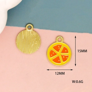 Detailed macro view of orange slice charms with 15mm dimensions and 0.6g weight metrics