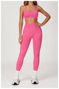 Detail of wide ribbed waistband and high-stretch fabric on rose pink seamless yoga set