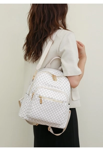 Close-up of white checkerboard PU leather backpack with luxury gold hardware details