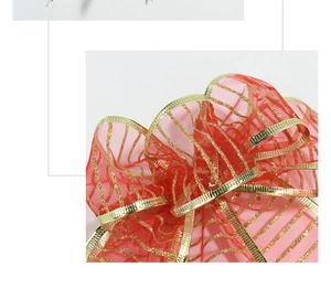 Detail of red mesh Christmas bow with gold sequin stripes and metallic edge trim