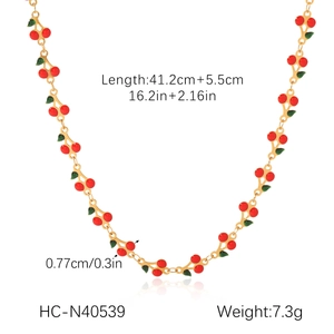 Detailed view of red cherry necklace with dimensions of 41.2cm plus 5.5cm extension