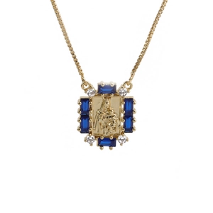 Golden pendant necklace with blue gemstone and relief figure on a box chain