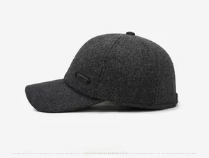 Detail of winter baseball cap with thick wool texture and metal Sport side plaque