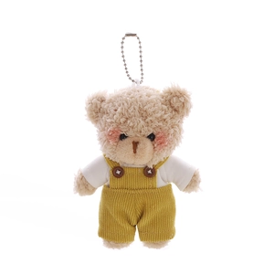 Portachiavi orsetto di peluche beige con salopette gialla e maglietta bianca