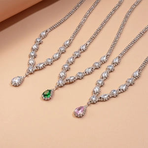 Detail of luxury water drop pendants in white green and pink zircon on silver necklace