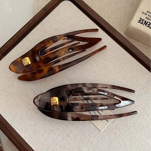 Durable resin swallowtail hair clips in tortoiseshell and dark brown with gold accents