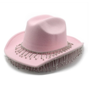 Detail of pink cowboy hat featuring sparkling silver rhinestone fringe on the brim