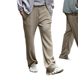 Men's loose fit striped knit trousers in beige with drawstring waist and wide leg cut