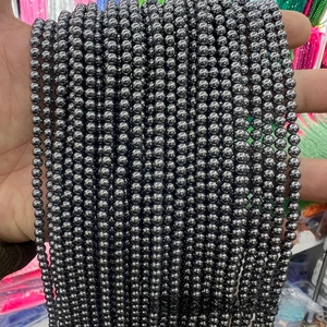 Close-up of faceted terahertz energy stone beads with high metallic luster for jewelry DIY
