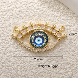 Detailed view of evil eye jewelry pendant with size specs and cubic zirconia in gold finish
