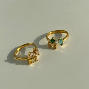 Detail of 18k gold plated ring featuring colorful geometric zircons and open band