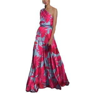 Detail of pink and blue leaf print on the pleated texture of this off-shoulder maxi dress